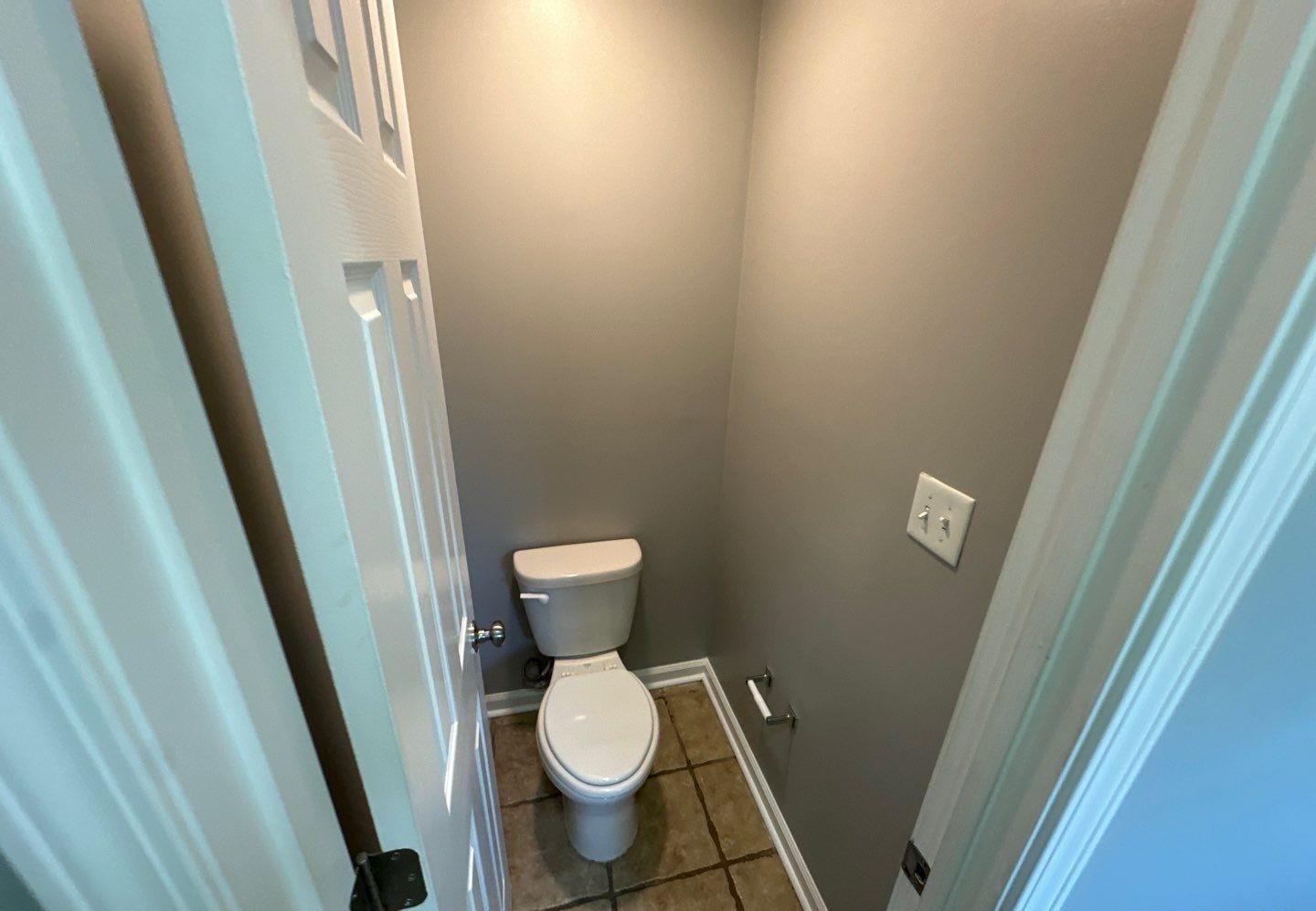 9420 Grove Road Cordova, TN 38016 - Photo 15 of 15 Bathroom featuring toilet and dark tile patterned floors