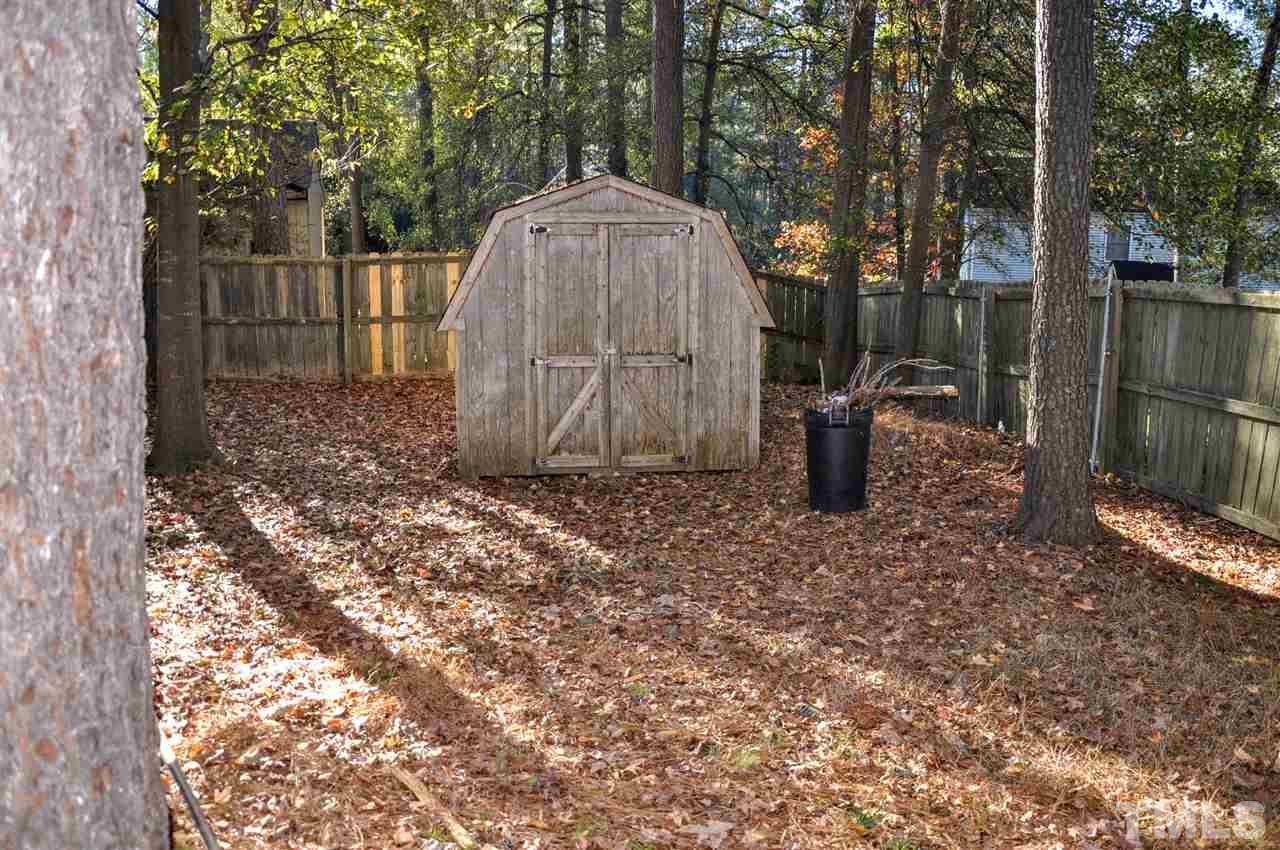 5104 Ranada Court Raleigh, NC 27616 - Photo 14 of 14 a backyard of a house with lots of green space