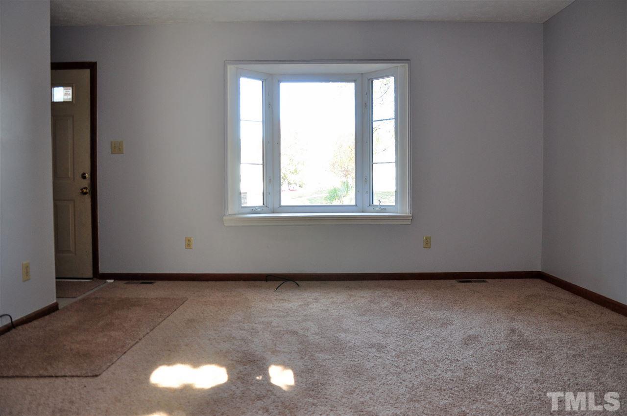 5104 Ranada Court Raleigh, NC 27616 - Photo 3 of 14 an empty room with a window
