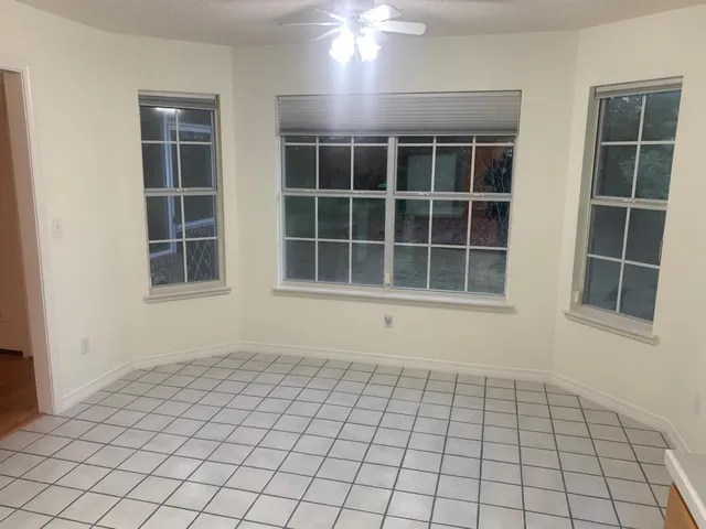 a view of empty room with windows