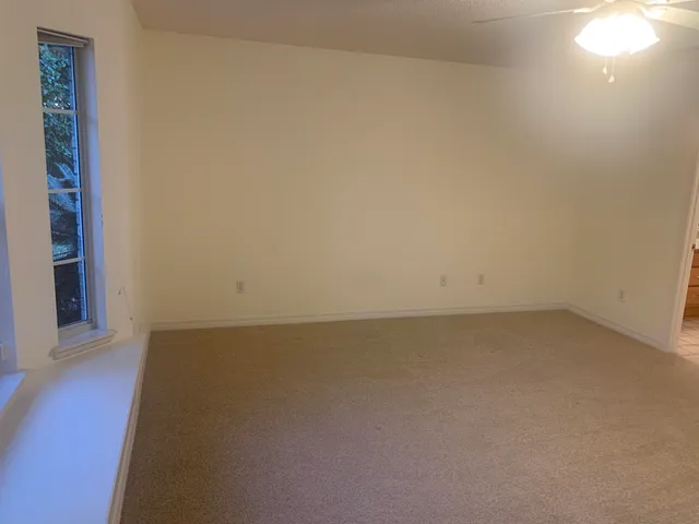 a view of an empty room and window