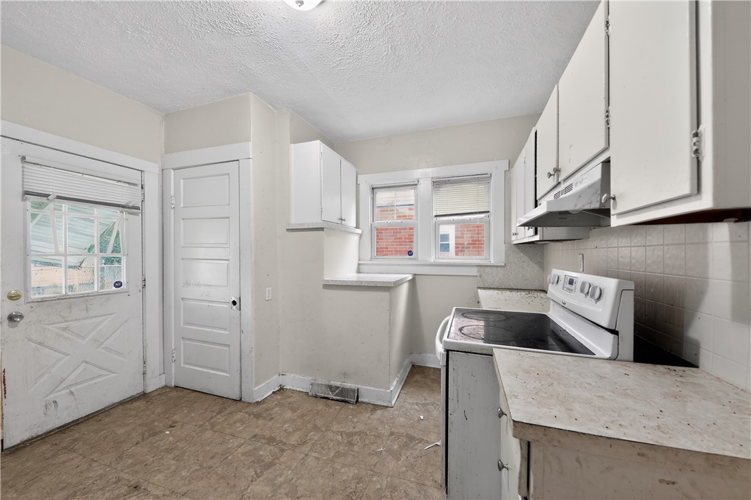 205 Rita Street Dayton, OH 45404 - Photo 11 of 34 This kitchen presents a blank canvas, ready for your creative vision.