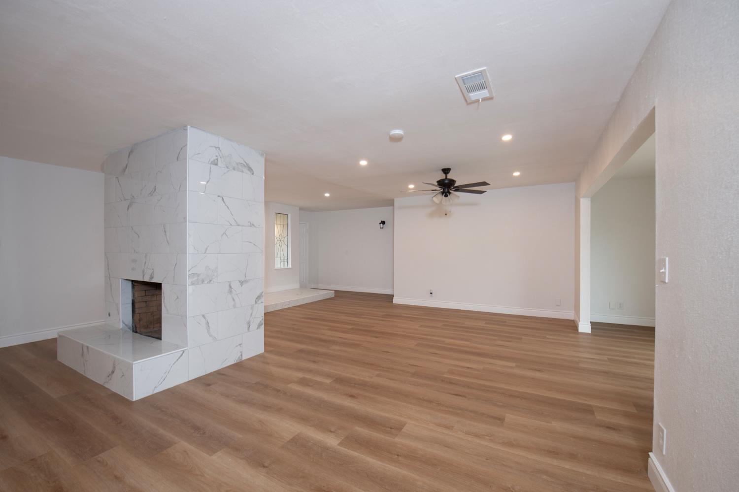 5167 East Dwight Way Fresno, CA 93727 - Photo 13 of 30 a view of a kitchen with a sink and a refrigerator
