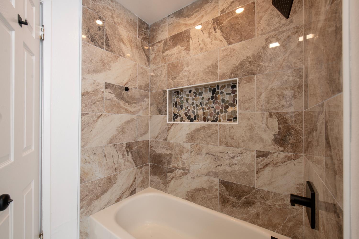 5167 East Dwight Way Fresno, CA 93727 - Photo 15 of 30 a bathroom with a shower