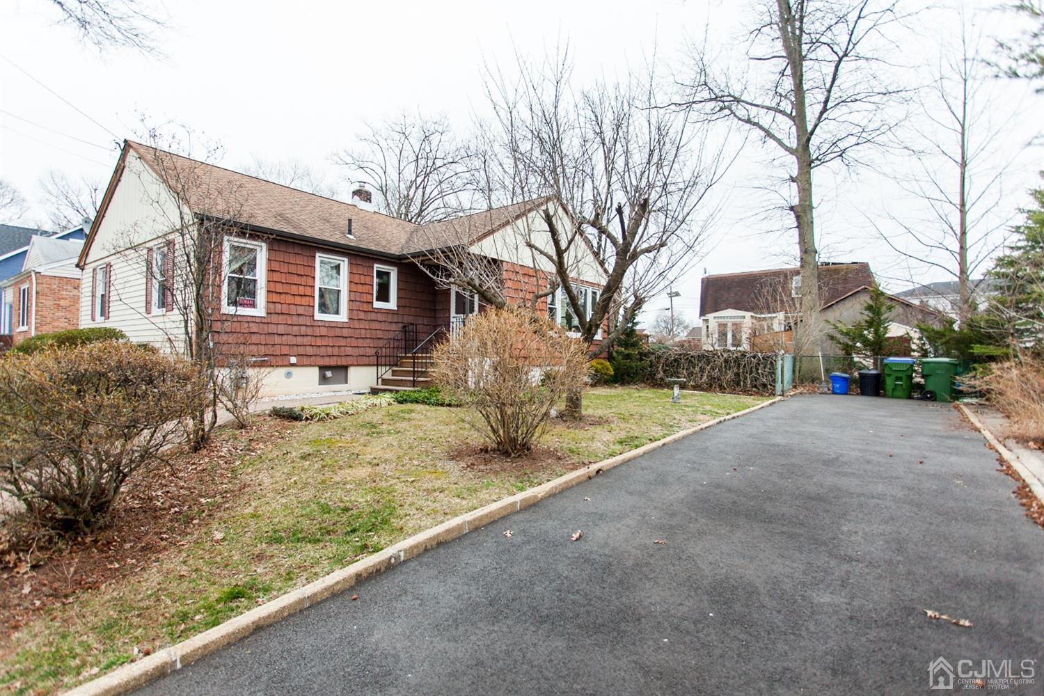 111 Alfred Street Edison, NJ 08820 - Photo 2 of 15 a front view of a house with garden