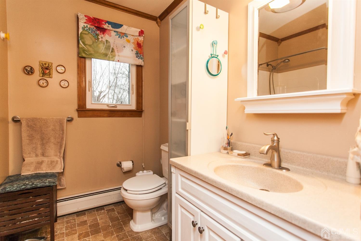 111 Alfred Street Edison, NJ 08820 - Photo 11 of 15 a bathroom with a granite countertop toilet sink and a mirror