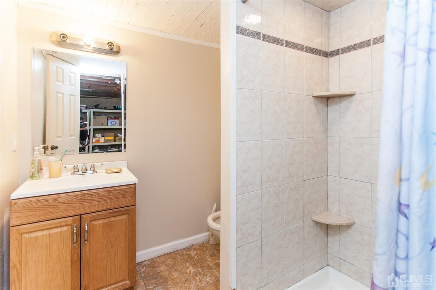 111 Alfred Street Edison, NJ 08820 - Photo 12 of 15 a bathroom with a sink vanity and a mirror