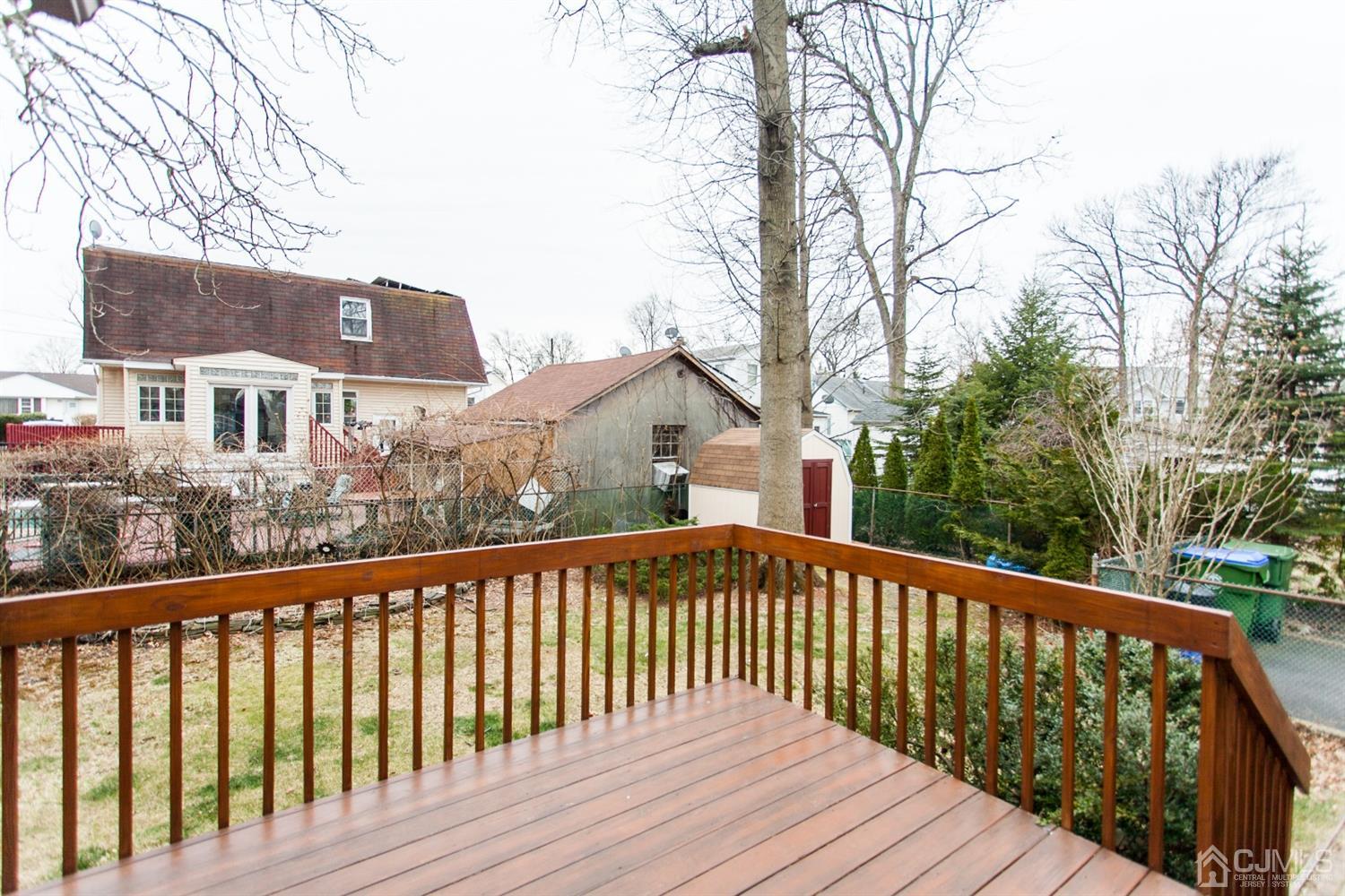 111 Alfred Street Edison, NJ 08820 - Photo 14 of 15 a view of wooden deck and a yard