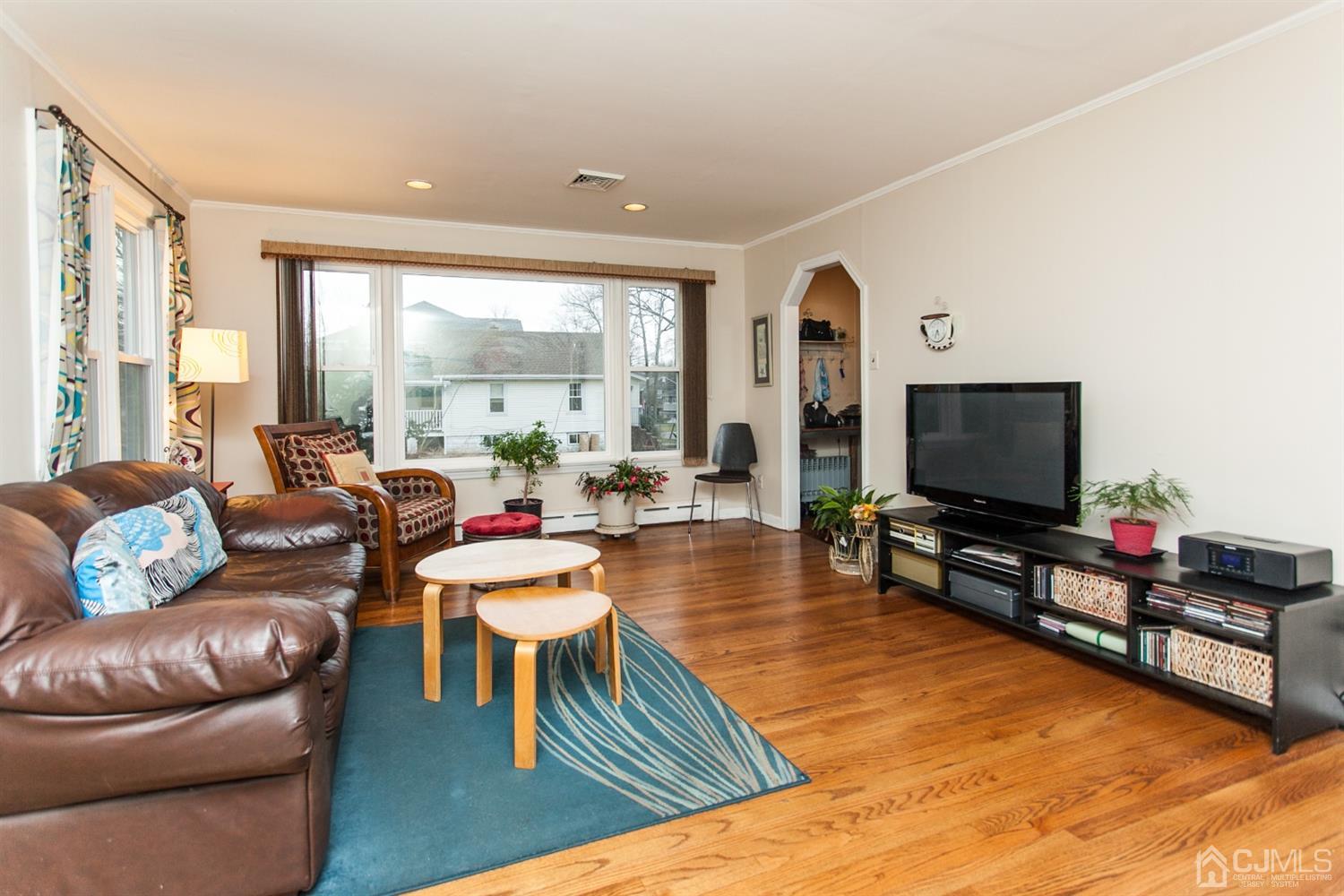 111 Alfred Street Edison, NJ 08820 - Photo 3 of 15 a living room with furniture and a flat screen tv