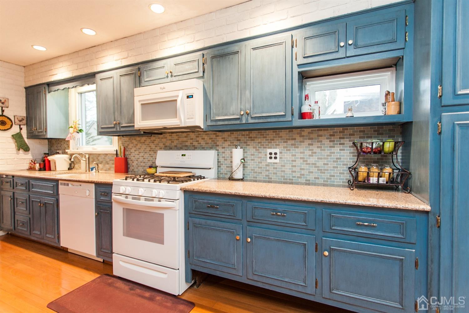 111 Alfred Street Edison, NJ 08820 - Photo 6 of 15 a kitchen with stainless steel appliances granite countertop a sink a stove and cabinets