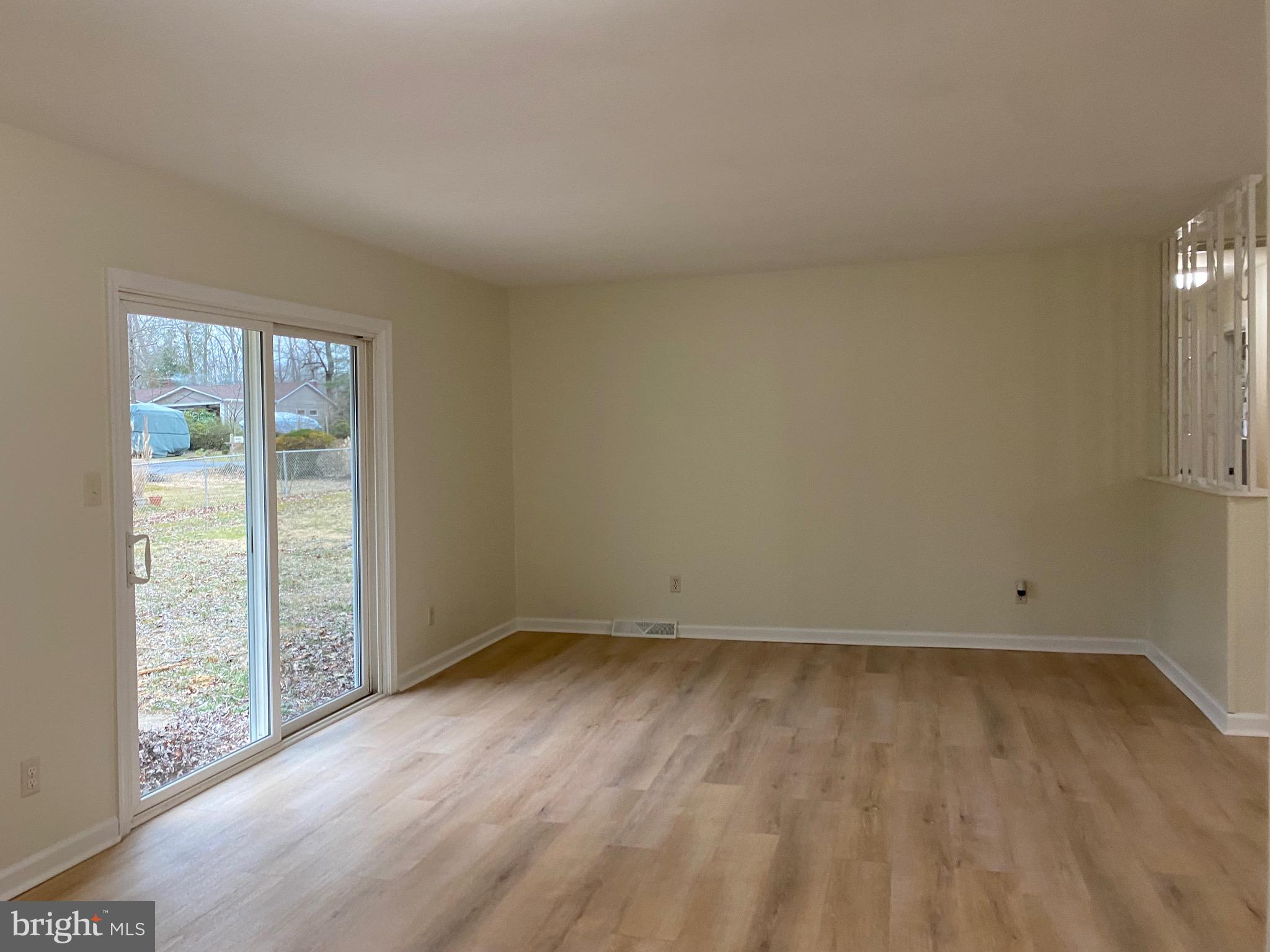 45255 Cove Manor Road California, MD 20619 - Photo 3 of 15 living room; new paint and flooring throughout