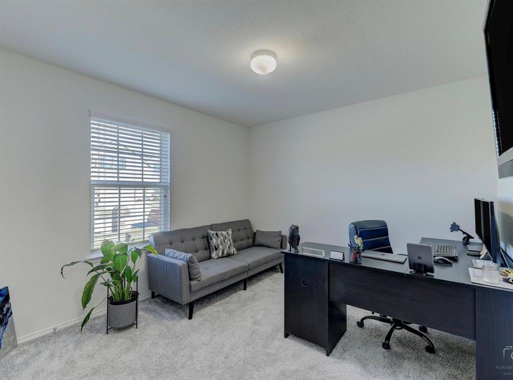 2207 Heaton Street Forney, TX 75126 - Photo 22 of 25 Bright room with light gray carpeting and white walls
