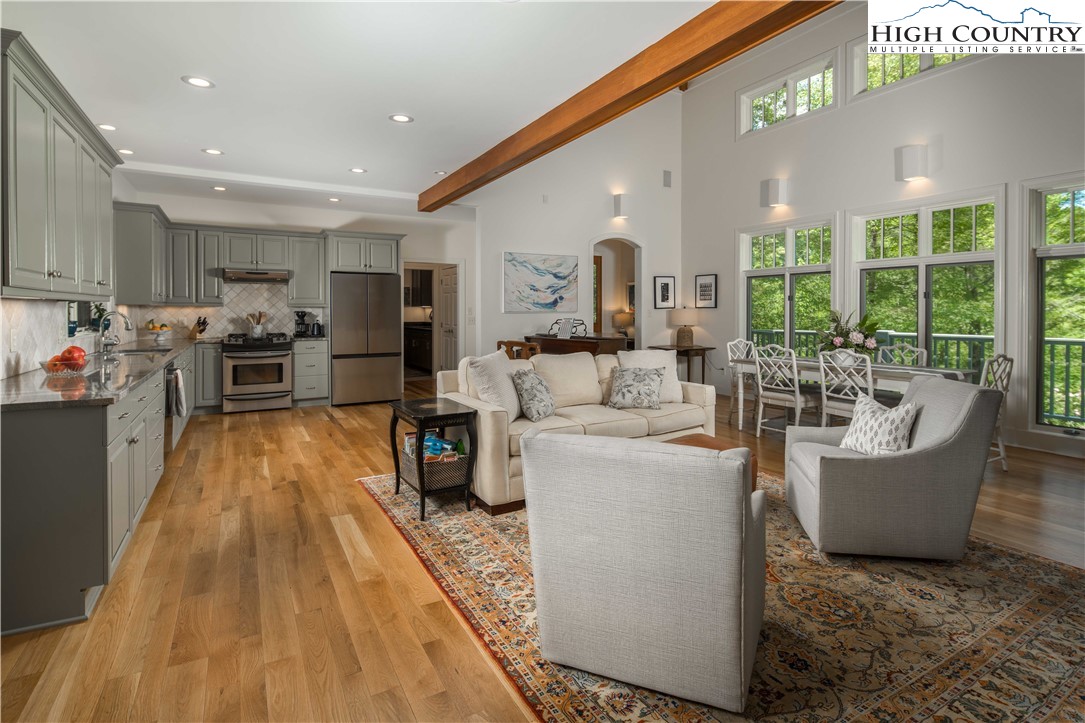 509 Twin Rivers Drive Boone, NC 28607 - Photo 13 of 50 a living room with furniture and large windows