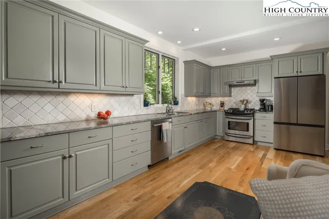 a bedroom with a large bed and a large window