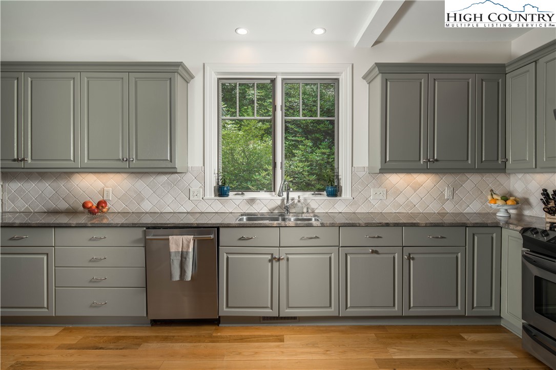 509 Twin Rivers Drive Boone, NC 28607 - Photo 17 of 50 a kitchen with sink cabinets and window