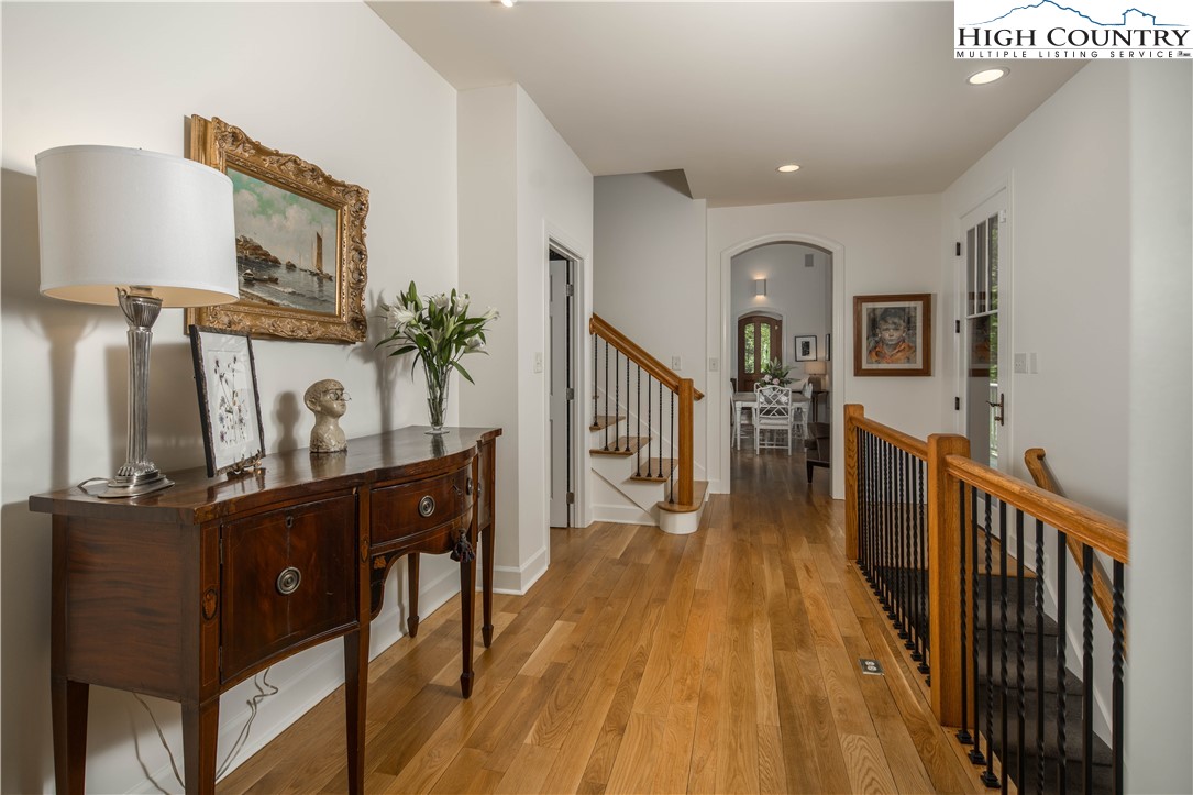 509 Twin Rivers Drive Boone, NC 28607 - Photo 20 of 50 a view of a hallway with wooden floor and stairs