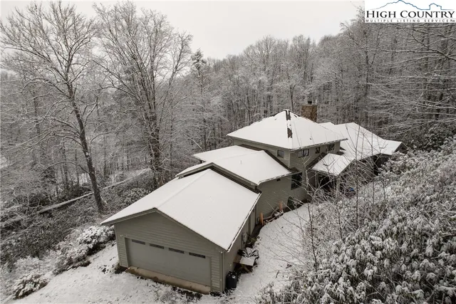 a living room with fireplace furniture and a wooden floor