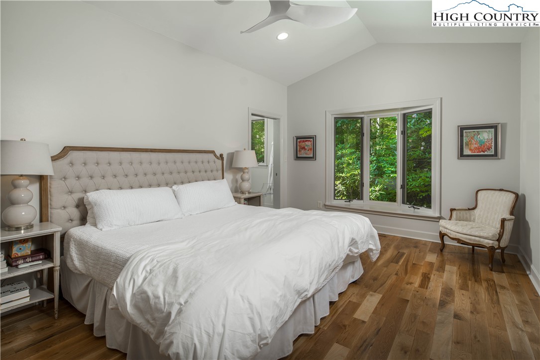 509 Twin Rivers Drive Boone, NC 28607 - Photo 24 of 50 a bedroom with a bed and a large window