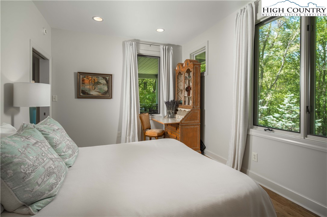 509 Twin Rivers Drive Boone, NC 28607 - Photo 34 of 50 a bedroom with a large bed and a window