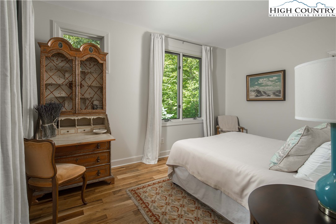 509 Twin Rivers Drive Boone, NC 28607 - Photo 35 of 50 a bedroom with a bed and a window