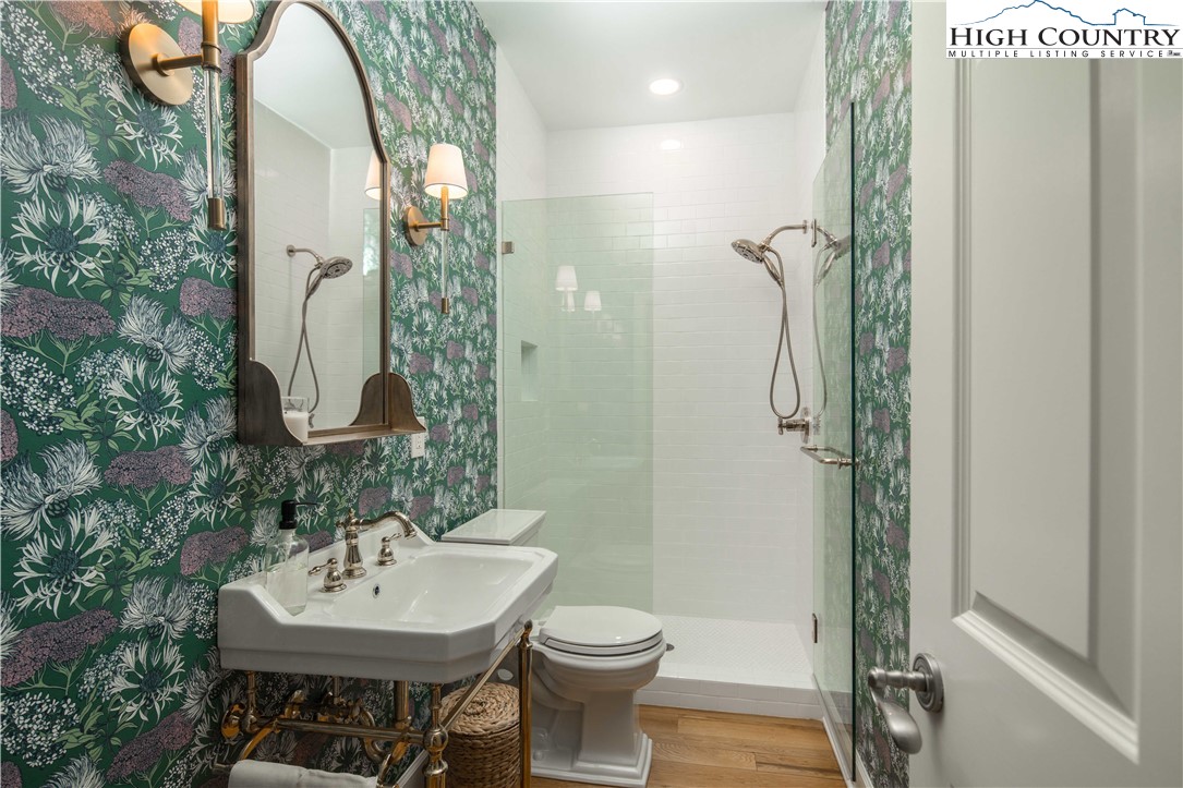 509 Twin Rivers Drive Boone, NC 28607 - Photo 36 of 50 a bathroom with a sink a toilet and shower