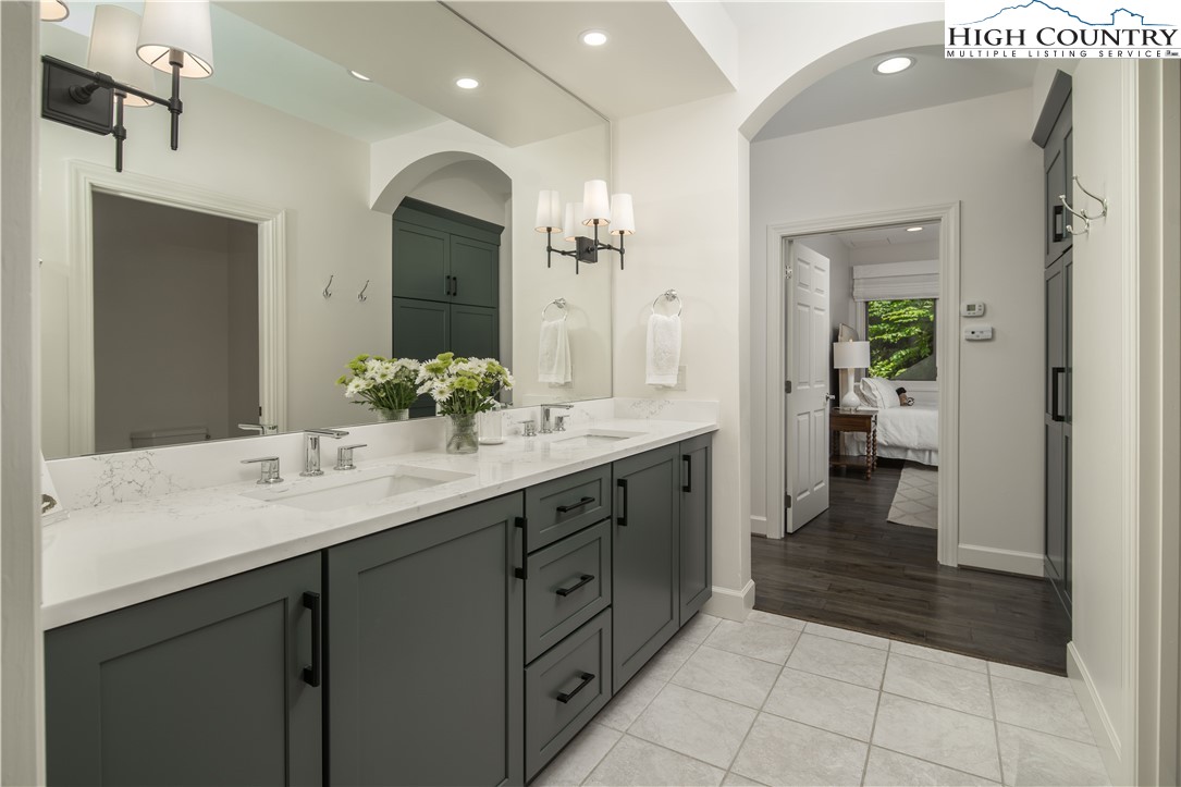 509 Twin Rivers Drive Boone, NC 28607 - Photo 39 of 50 a bathroom with a double vanity sink and a mirror