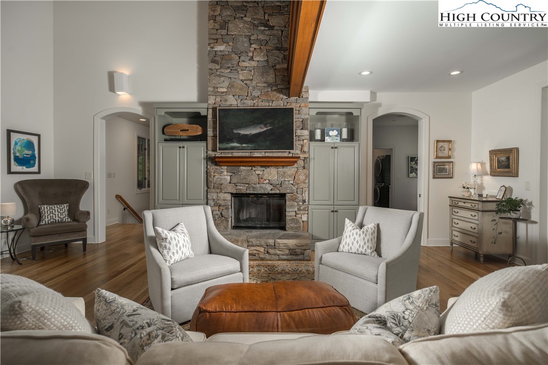 509 Twin Rivers Drive Boone, NC 28607 - Photo 10 of 50 a living room with furniture and a fireplace