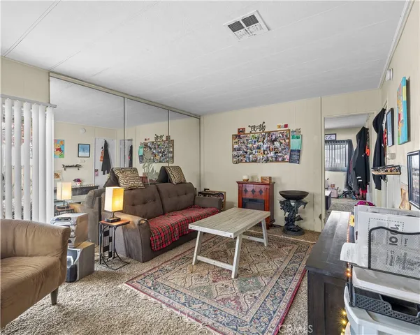 a living room with furniture and a rug