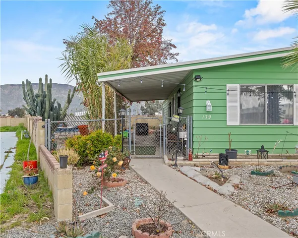 a view of a chairs and table in the patio