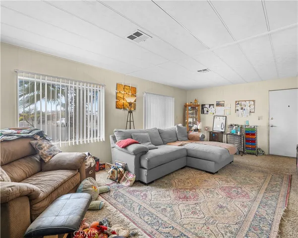 a living room with furniture and a couch
