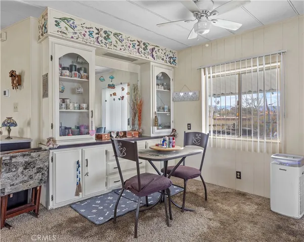 a view of a livingroom with furniture and window