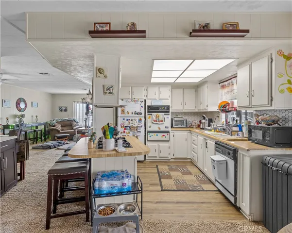 a kitchen with stainless steel appliances lots of counter top space