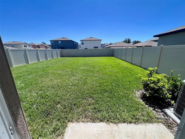 a view of a yard with an outdoor space