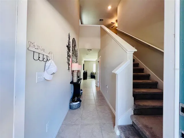 a view of entryway and hall with a hallway
