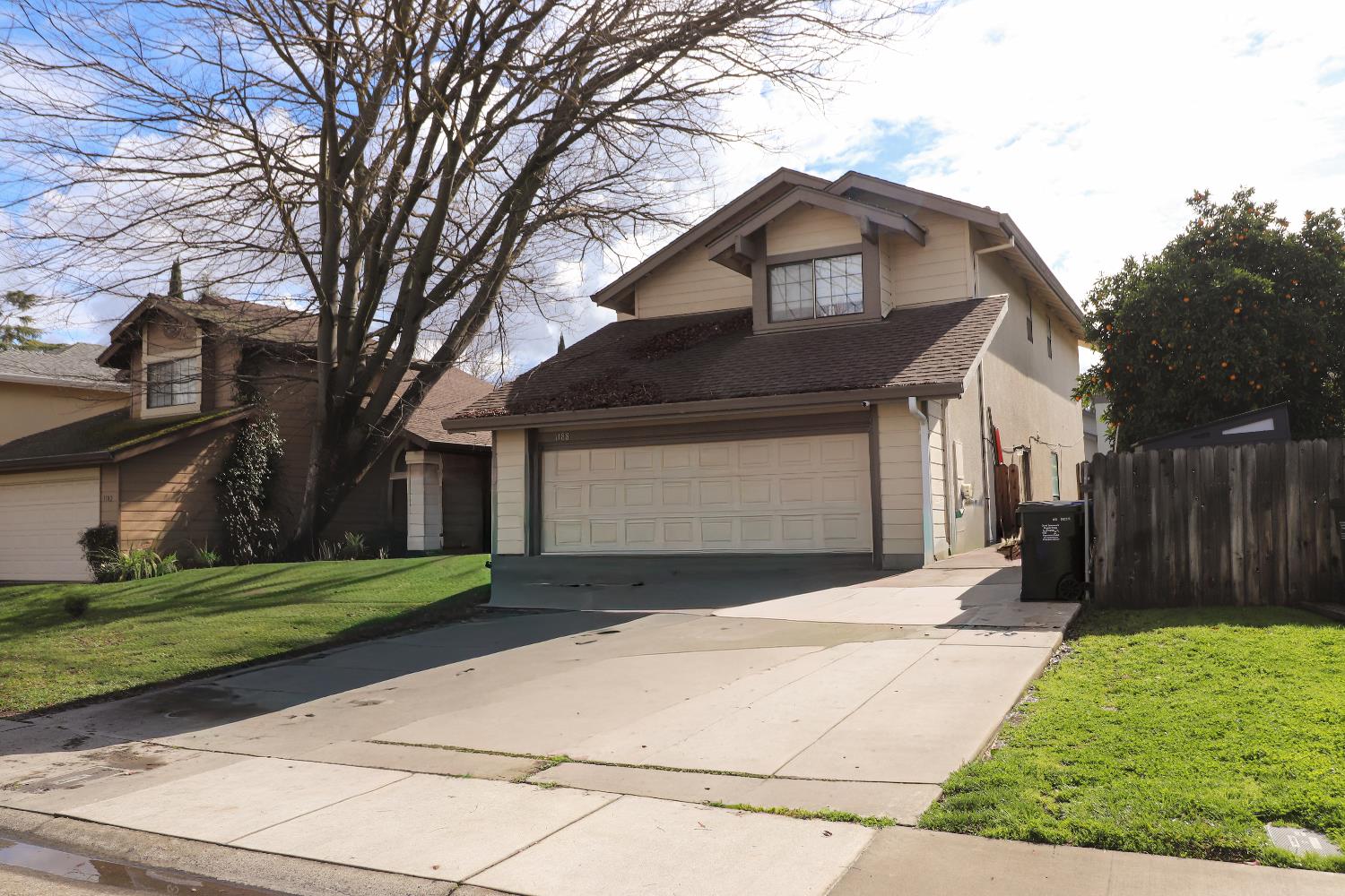 1188 Rio Royal Way Sacramento, CA 95834 - Photo 1 of 20 a front view of a house with a yard and garage