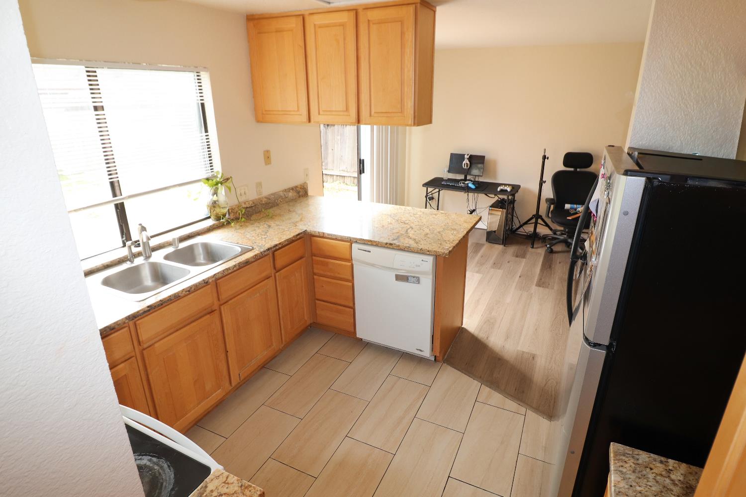1188 Rio Royal Way Sacramento, CA 95834 - Photo 11 of 20 a kitchen with a sink a refrigerator and window