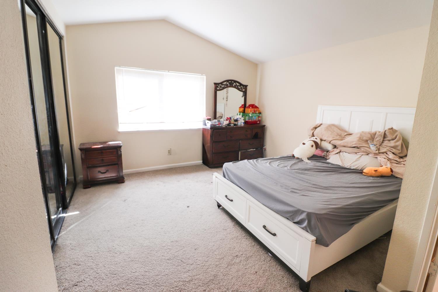 1188 Rio Royal Way Sacramento, CA 95834 - Photo 16 of 20 a bedroom with a bed and a dresser in it
