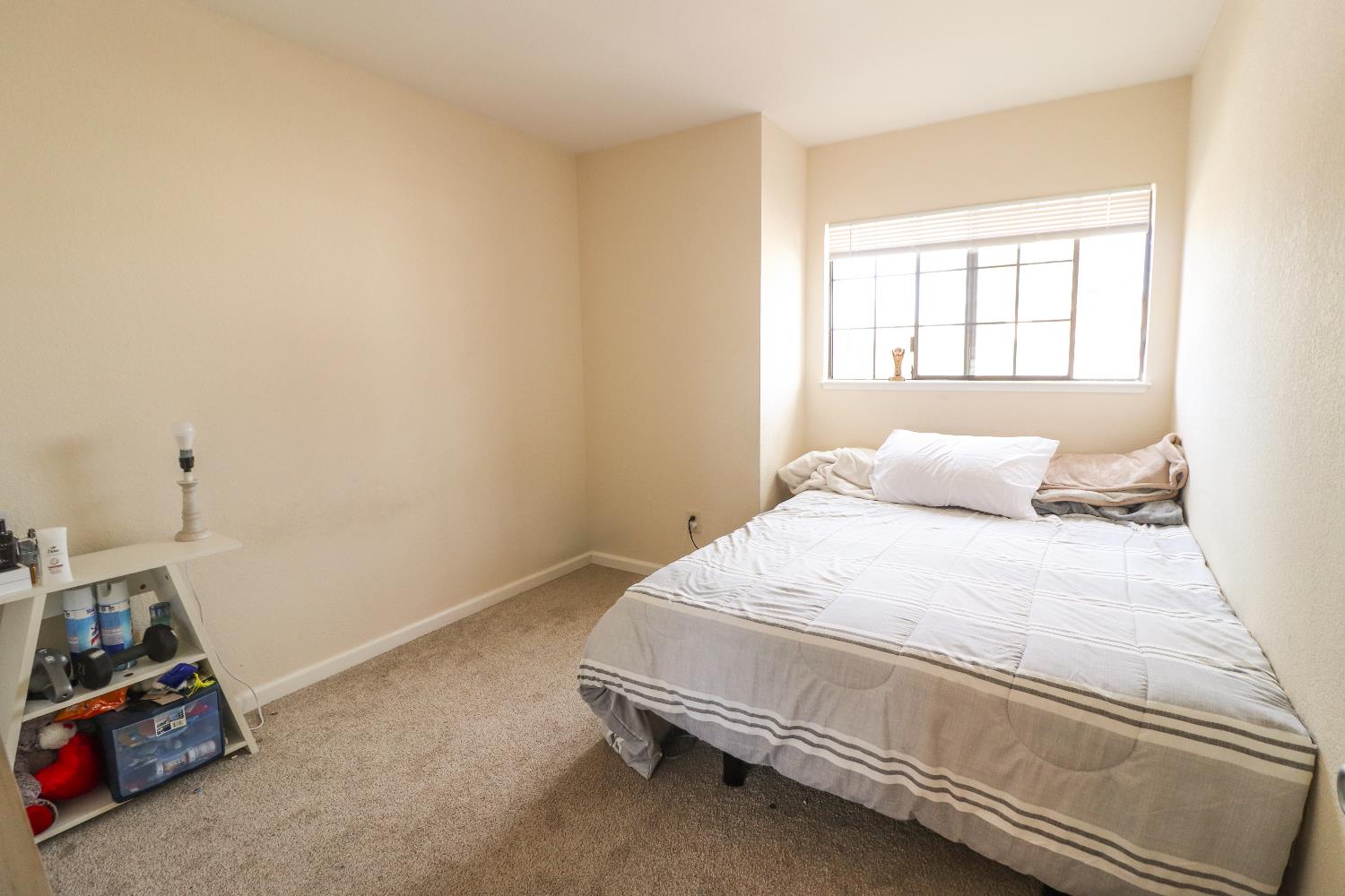 1188 Rio Royal Way Sacramento, CA 95834 - Photo 18 of 20 a bedroom with a bed and a window