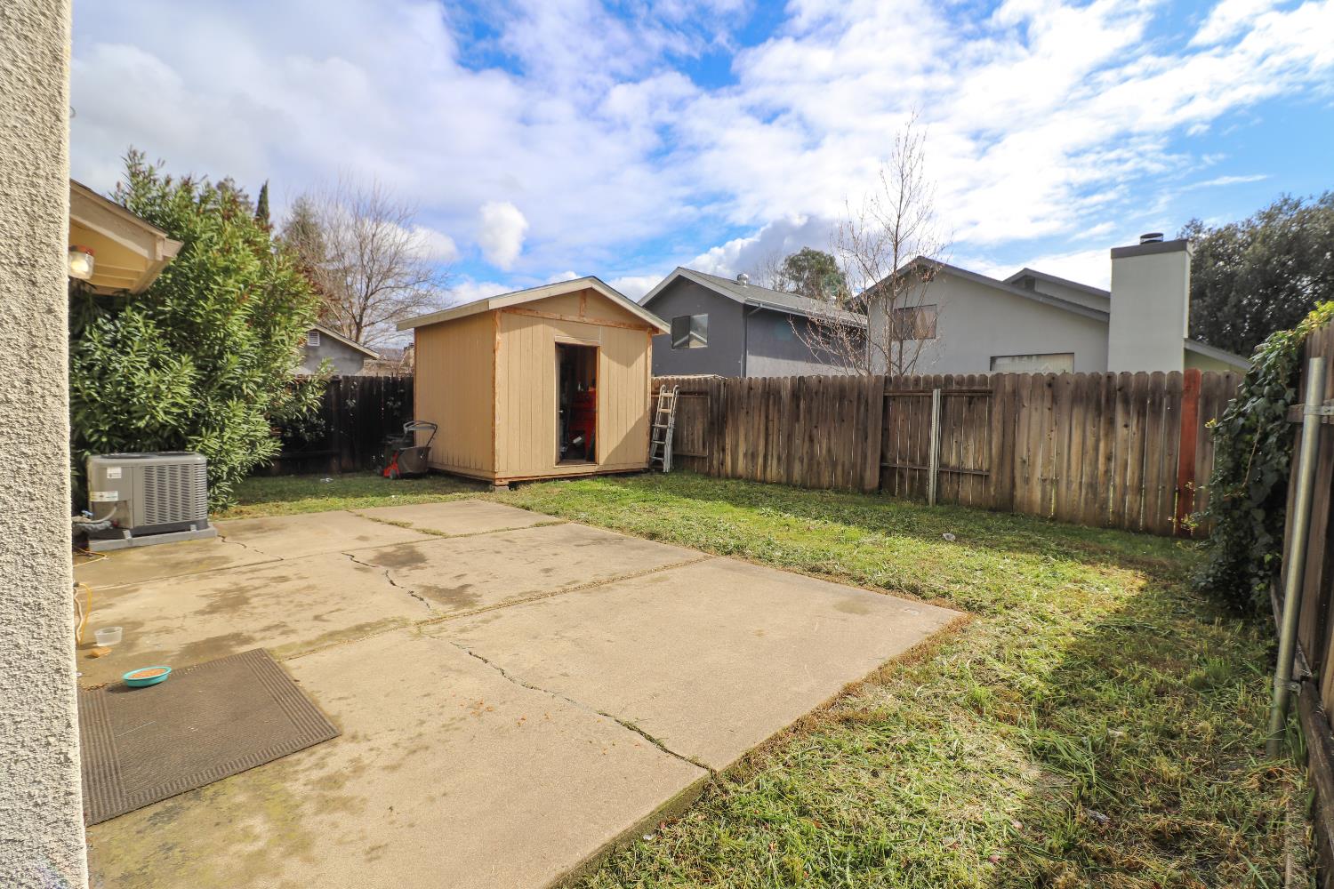 1188 Rio Royal Way Sacramento, CA 95834 - Photo 19 of 20 a front view of a house with a yard and garage