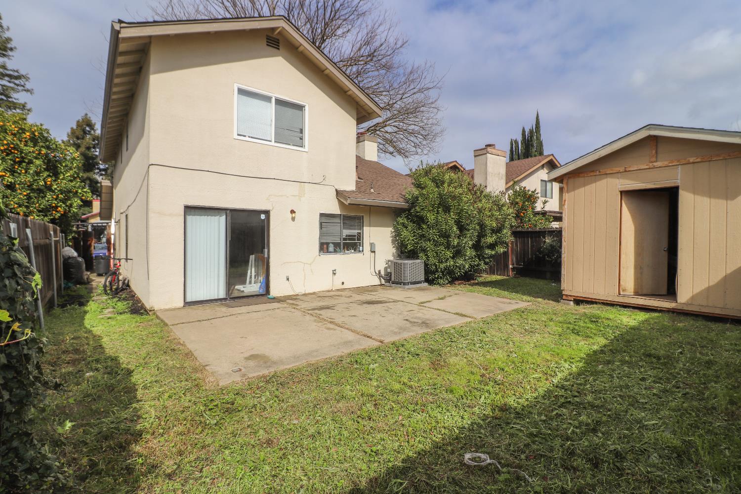 1188 Rio Royal Way Sacramento, CA 95834 - Photo 20 of 20 a view of a house with a yard and garage