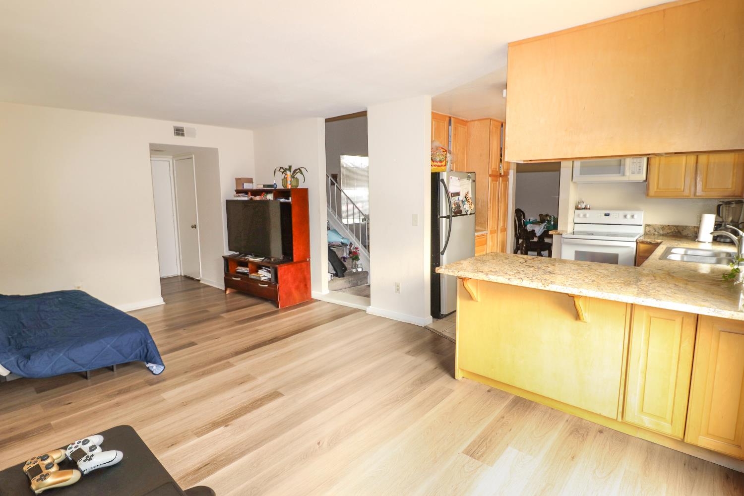 1188 Rio Royal Way Sacramento, CA 95834 - Photo 4 of 20 a bed room with a bed and a television