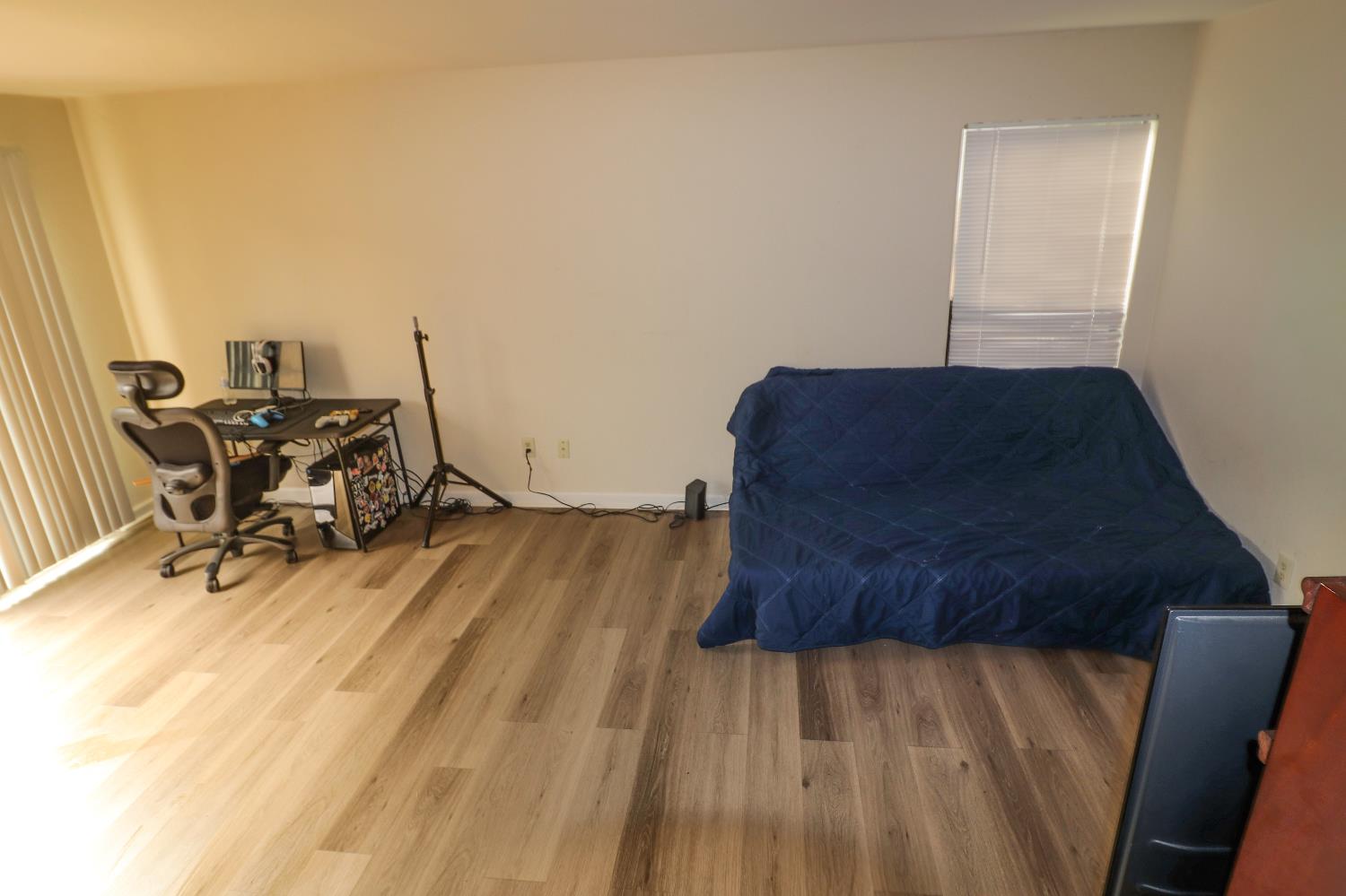 1188 Rio Royal Way Sacramento, CA 95834 - Photo 5 of 20 a living room with furniture and a wooden floor