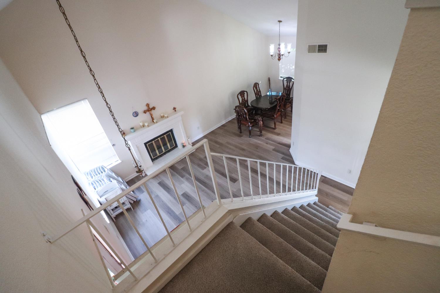 1188 Rio Royal Way Sacramento, CA 95834 - Photo 6 of 20 a view of stairs and bedroom with wooden floor