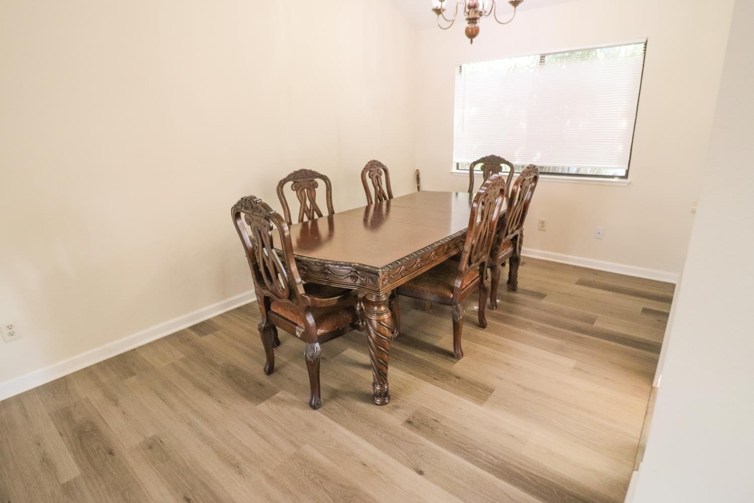 1188 Rio Royal Way Sacramento, CA 95834 - Photo 7 of 20 a view of a dining room with furniture and wooden floor