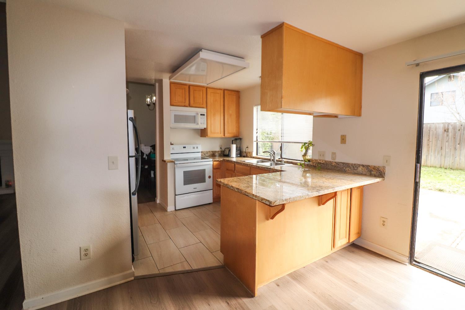 1188 Rio Royal Way Sacramento, CA 95834 - Photo 10 of 20 a kitchen with stainless steel appliances granite countertop a sink stove and refrigerator