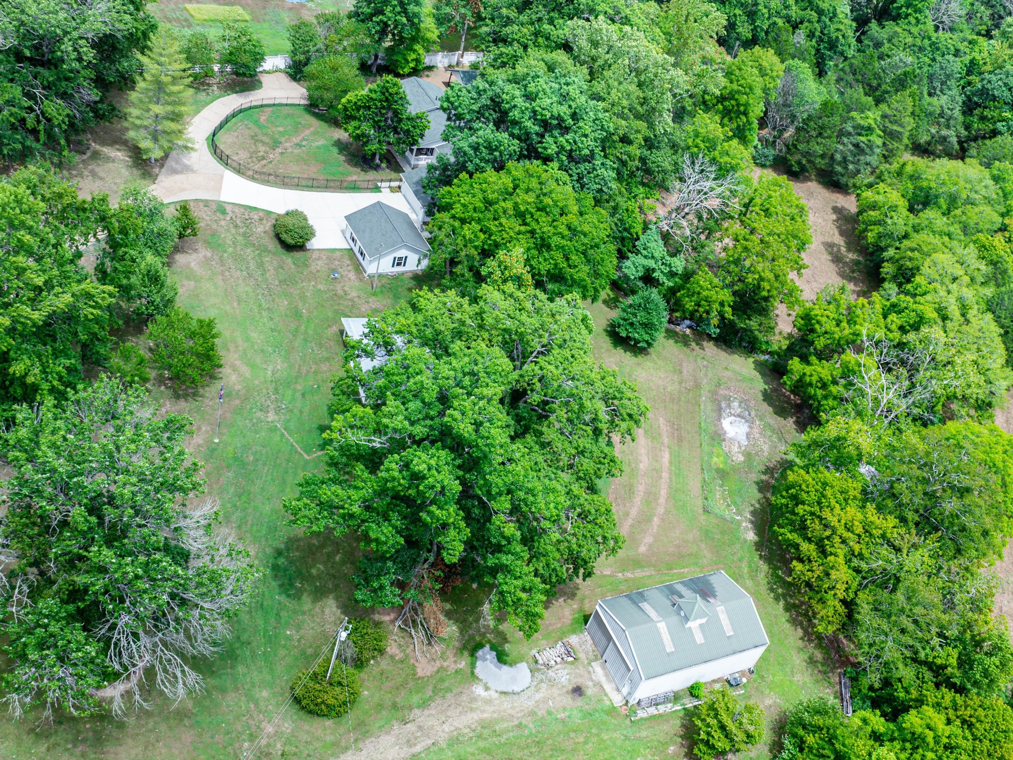 6838 Comstock Road College Grove, TN 37046 - Photo 54 of 64 Side view of property with the barn in the bottom corner and the home top middle