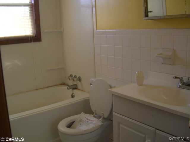 4230 Wakema Road West Point, VA 23181 - Photo 7 of 11 a bathroom with a sink a toilet and bathtub