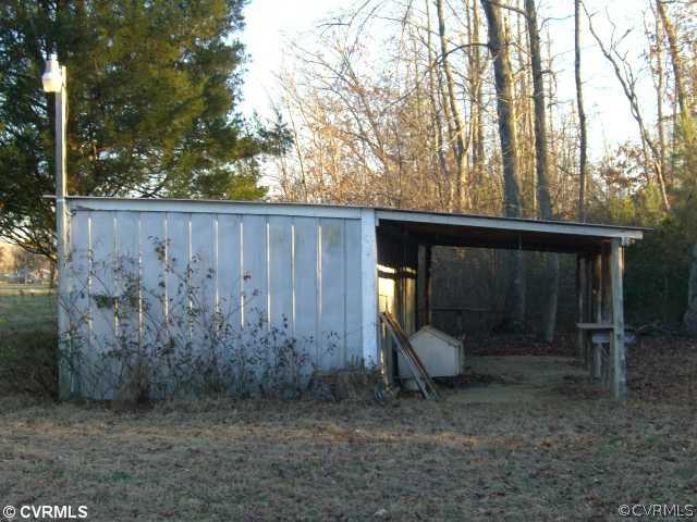 4230 Wakema Road West Point, VA 23181 - Photo 10 of 11 a view of a porch with a backyard and swing