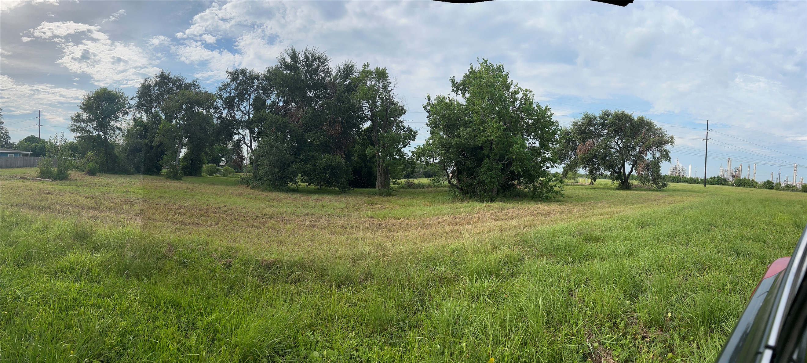 0 Muriel Street La Marque, TX 77568 - Photo 5 of 6 a view of a field with trees in background