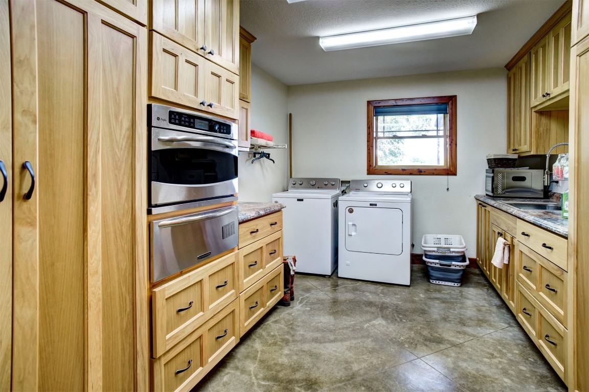 945 Justice Road West Point, TX 78963 - Photo 12 of 35 a utility room with dryer and washer